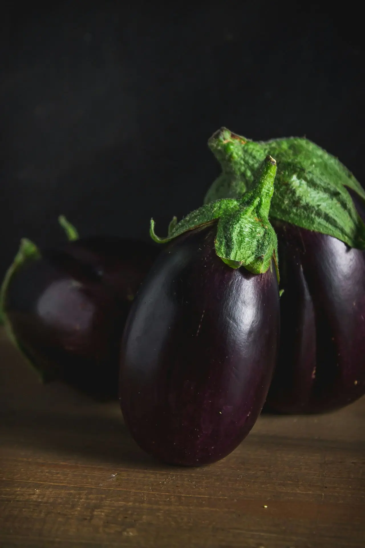 green bell pepper on brown wooden table